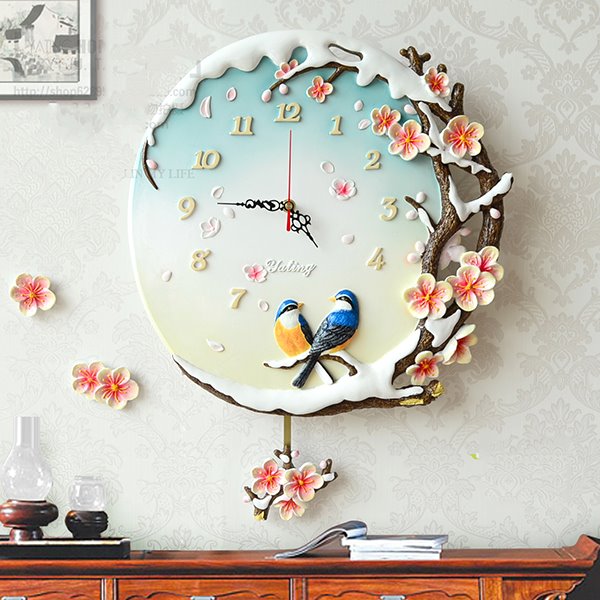 Reloj de pared de resina de urraca y flor de ciruelo pastoral